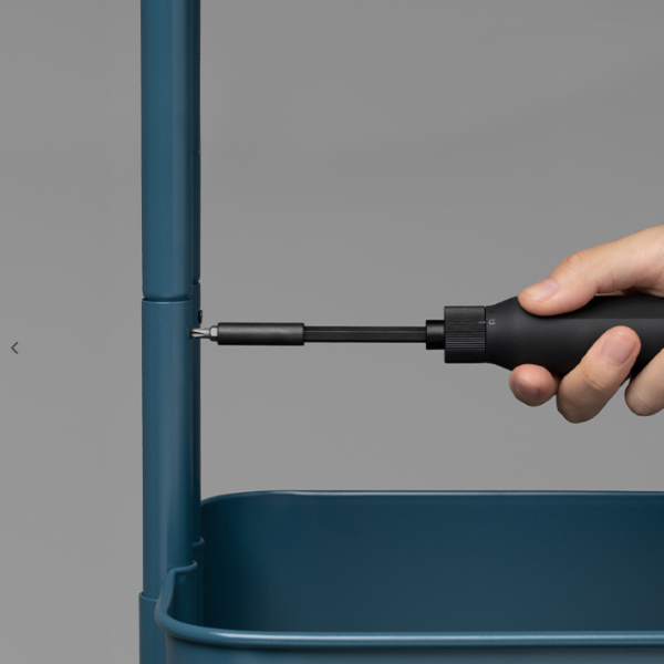 Hand using a screwdriver to assemble a blue metal frame against a gray background