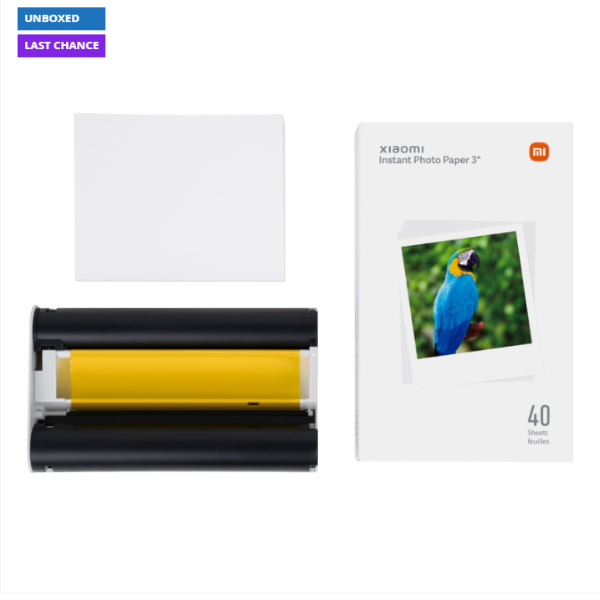 Xiaomi instant photo paper with a roll of yellow ink cartridge on a white background