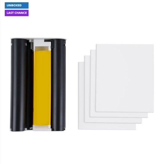 Black cylindrical device with yellow interior and white sheets on a white background