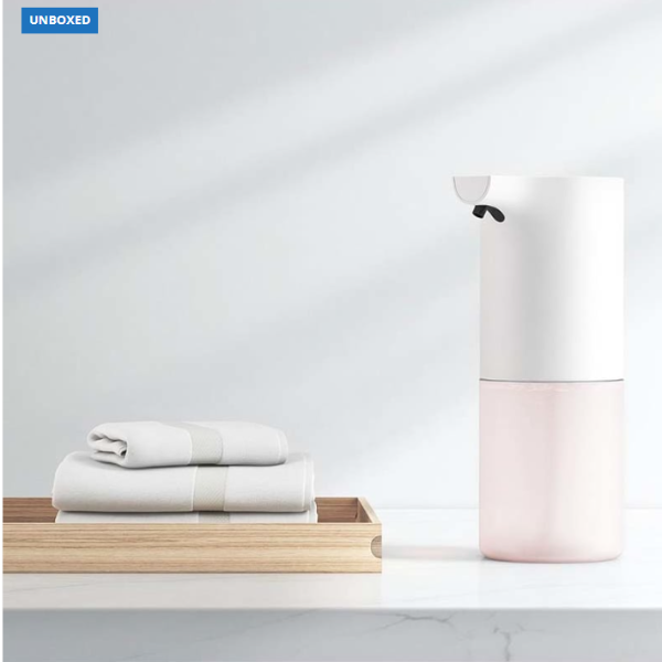 White and pink cylindrical container on a white background with 'UNBOXED' label.