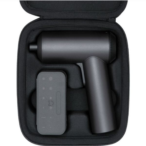 Black handheld device with a battery pack inside a black carrying case on a white background
