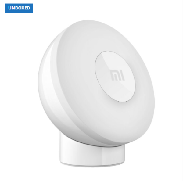 White round device with a brand logo on a white background