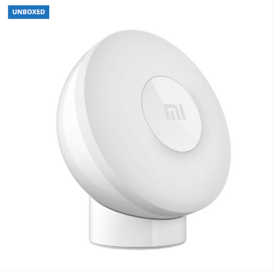 White round device with a brand logo on a white background