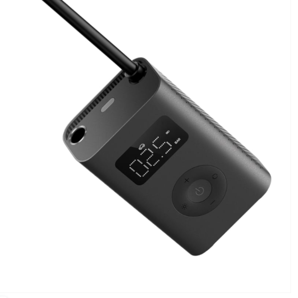 Black electronic device with digital display on a white background