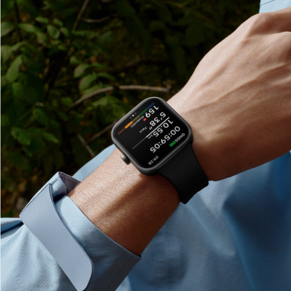 Smartwatch on a wrist with a blurred natural background