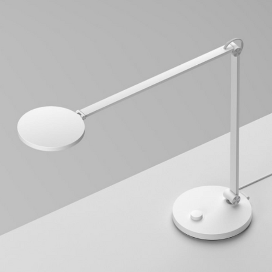 White desk lamp on a gray background