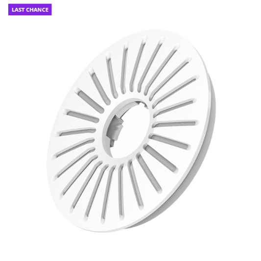 White circular object with slotted design on a white background