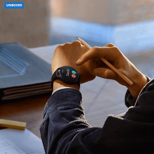 Person wearing a smartwatch with a blurred background