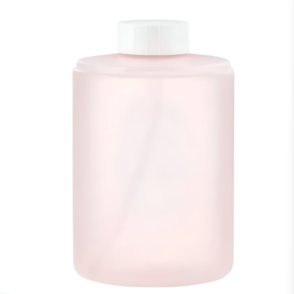 Pink cylindrical container with a white cap on a white background