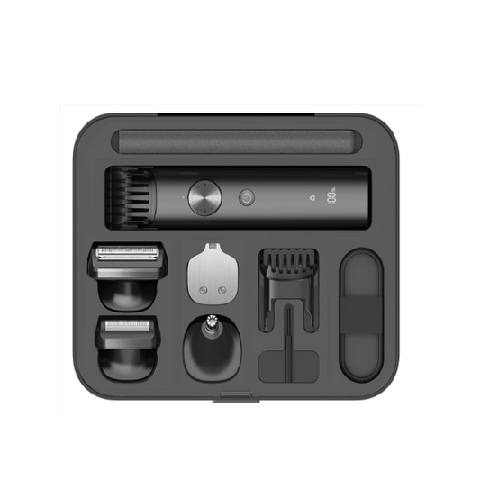 Black grooming kit with multiple attachments on a white background