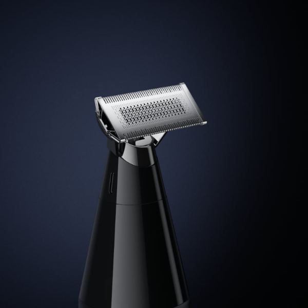 Black electric shaver on a dark blue background