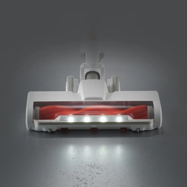 White and red vacuum cleaner head on a gray background